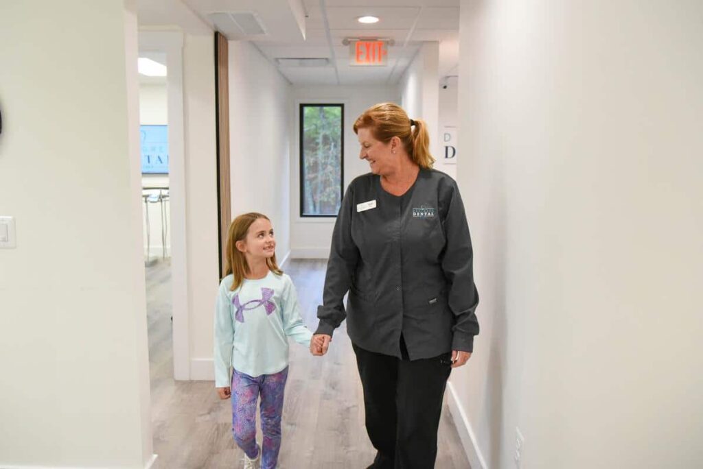 pediatric dental care walking hallway kind staff team child patient smiling gentle care